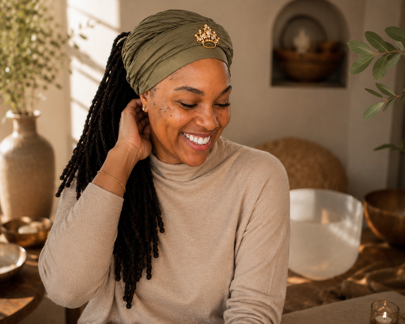 Anika, founder of Sol & Glo, seated with her crystal singing bowls